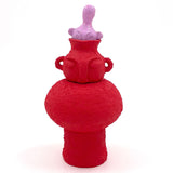 3 piece totem with a depiction of a defiant woman